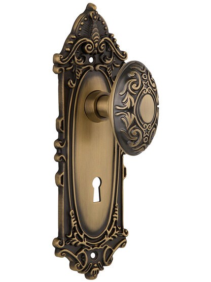 Largo Design Mortise Lock Set With Decorative Oval Knobs in Antique Brass.